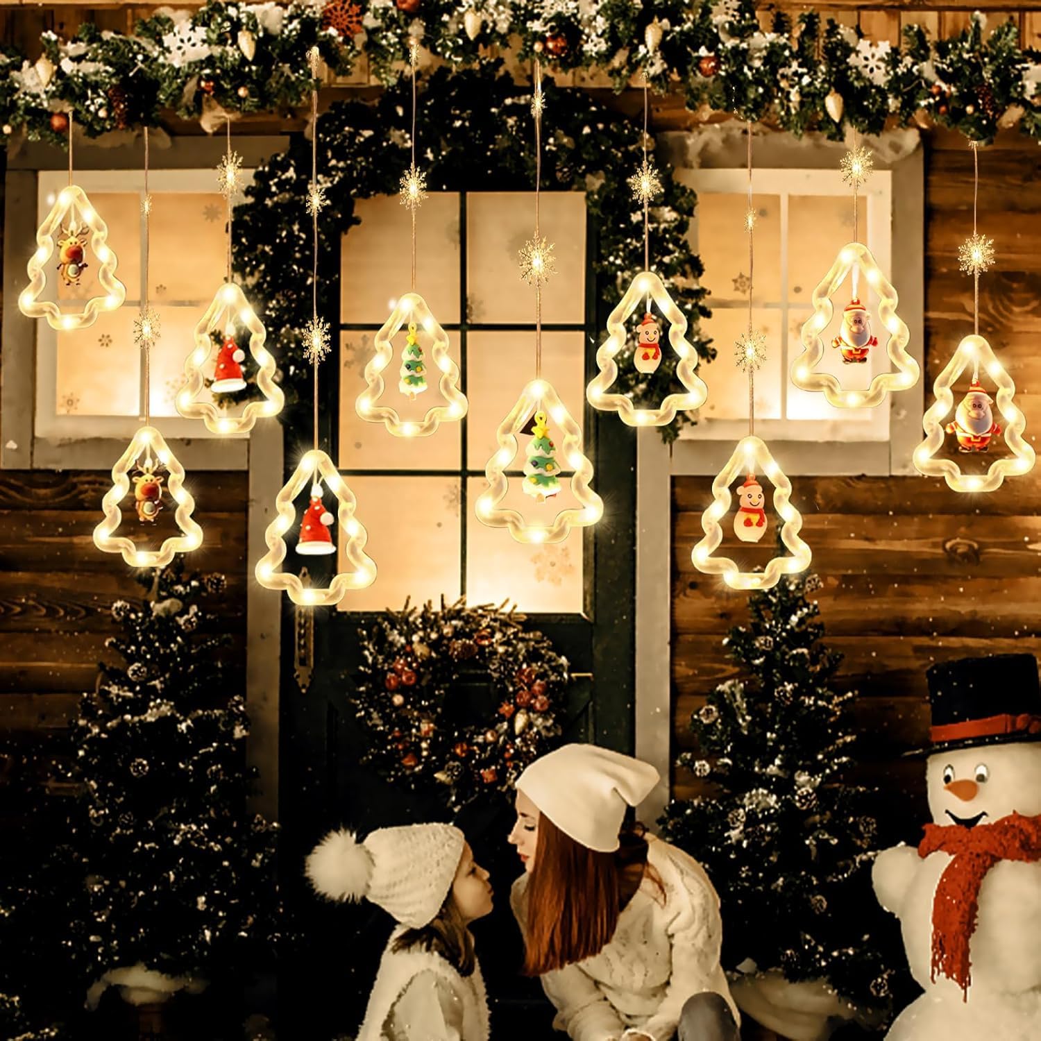 窓からクリスマスイルミネーションを見る子供達 10264003021 の写真・イラスト素材アマナイメージズ